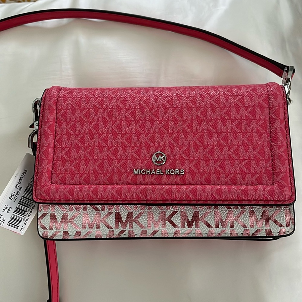 Pink Michael Kors monogram purse/wallet.
